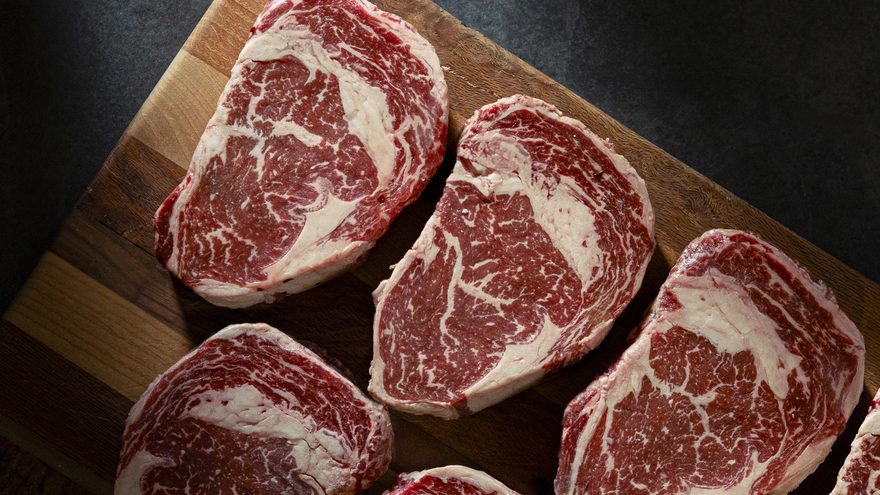 MeatWorks Co. dry-aged ribeye steaks on a wooden board